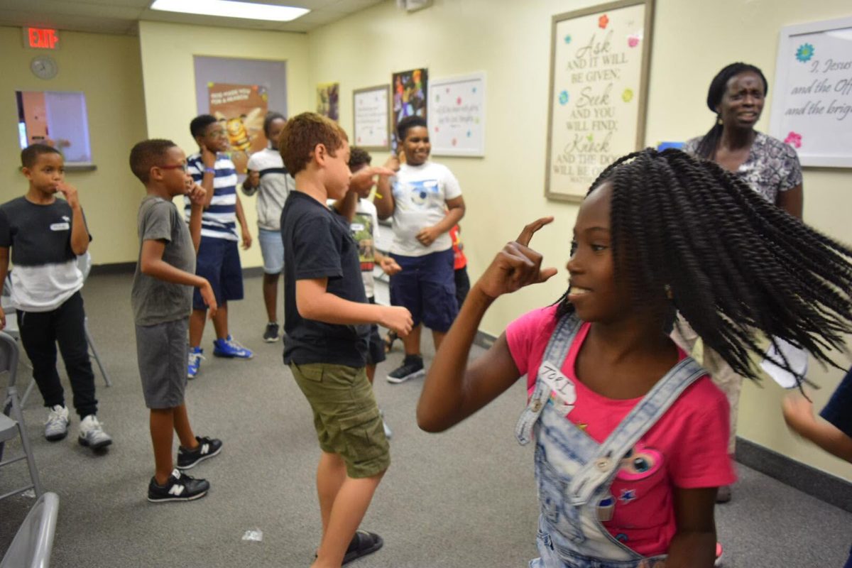 Children singing and moving together in PBF Kids