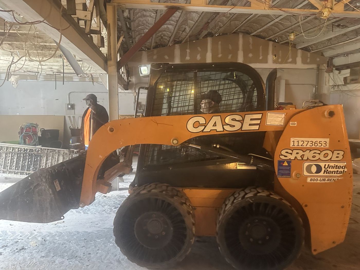 Heavy equipment moving debris